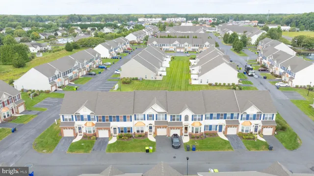 a aerial view of a house with table and chairs