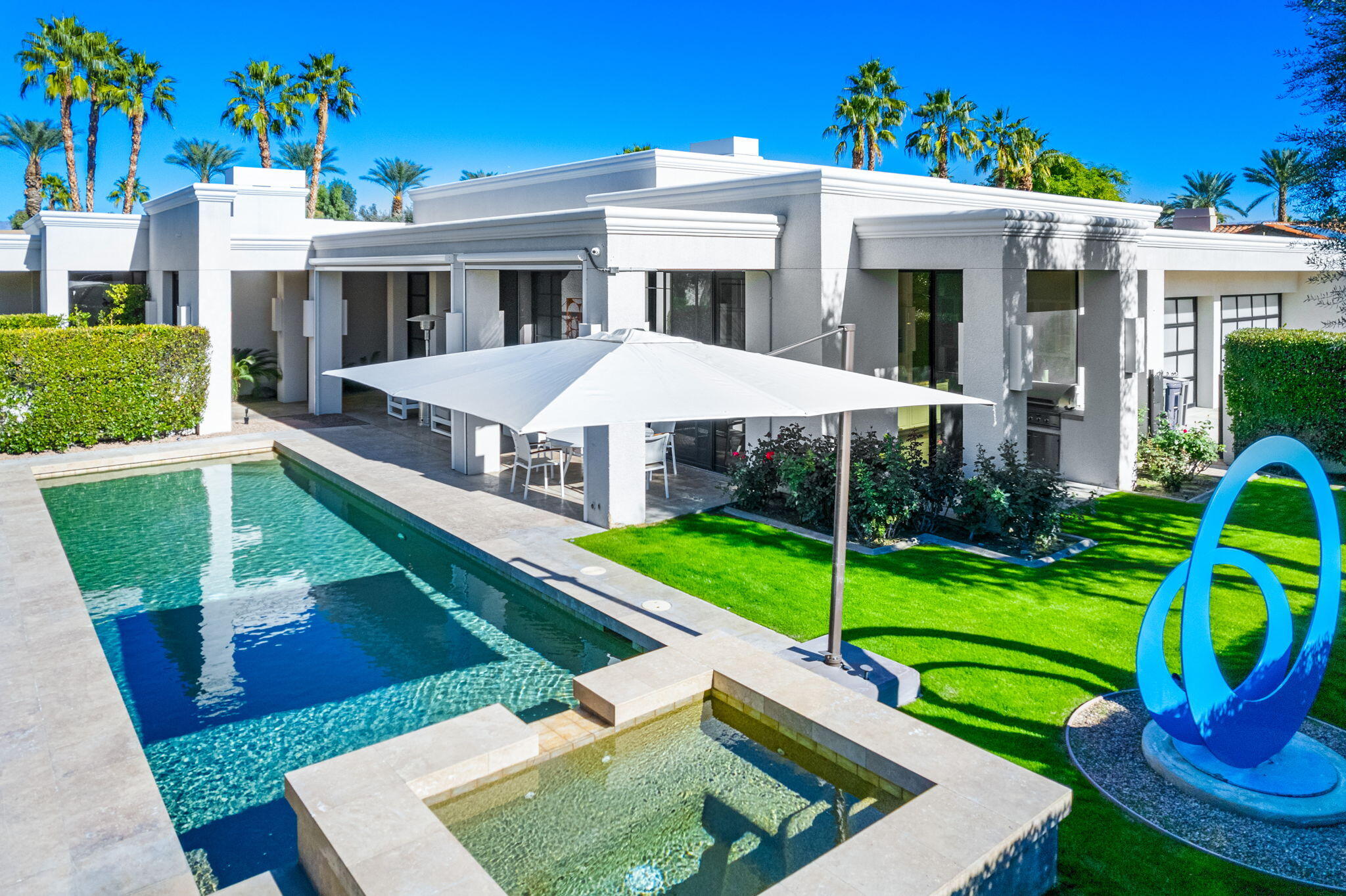 6 Sun Ridge Circle Rancho Mirage, CA 92270 - Photo 14 of 56 a view of a house with backyard porch and sitting area