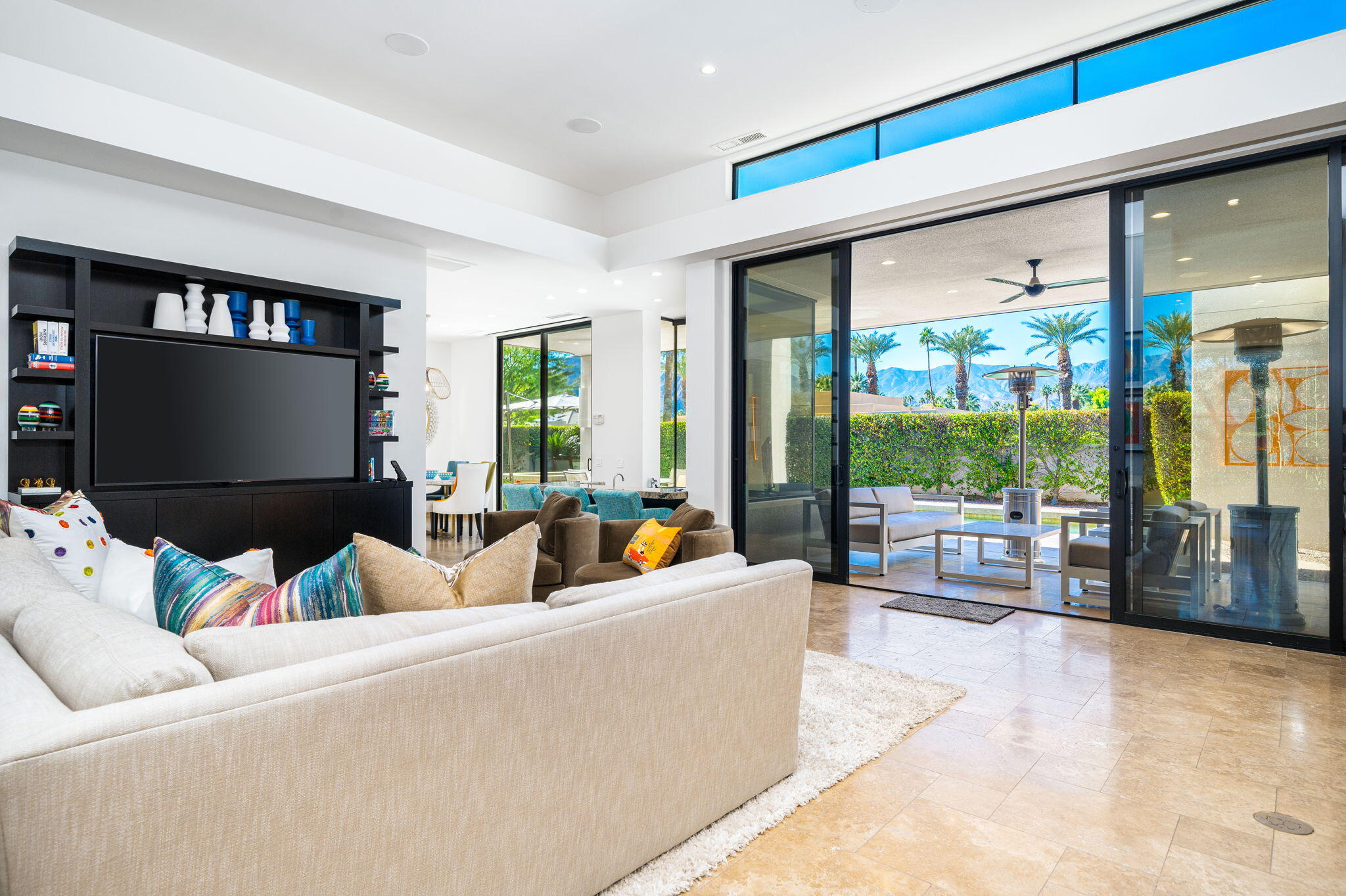 6 Sun Ridge Circle Rancho Mirage, CA 92270 - Photo 16 of 56 a living room with furniture and a flat screen tv