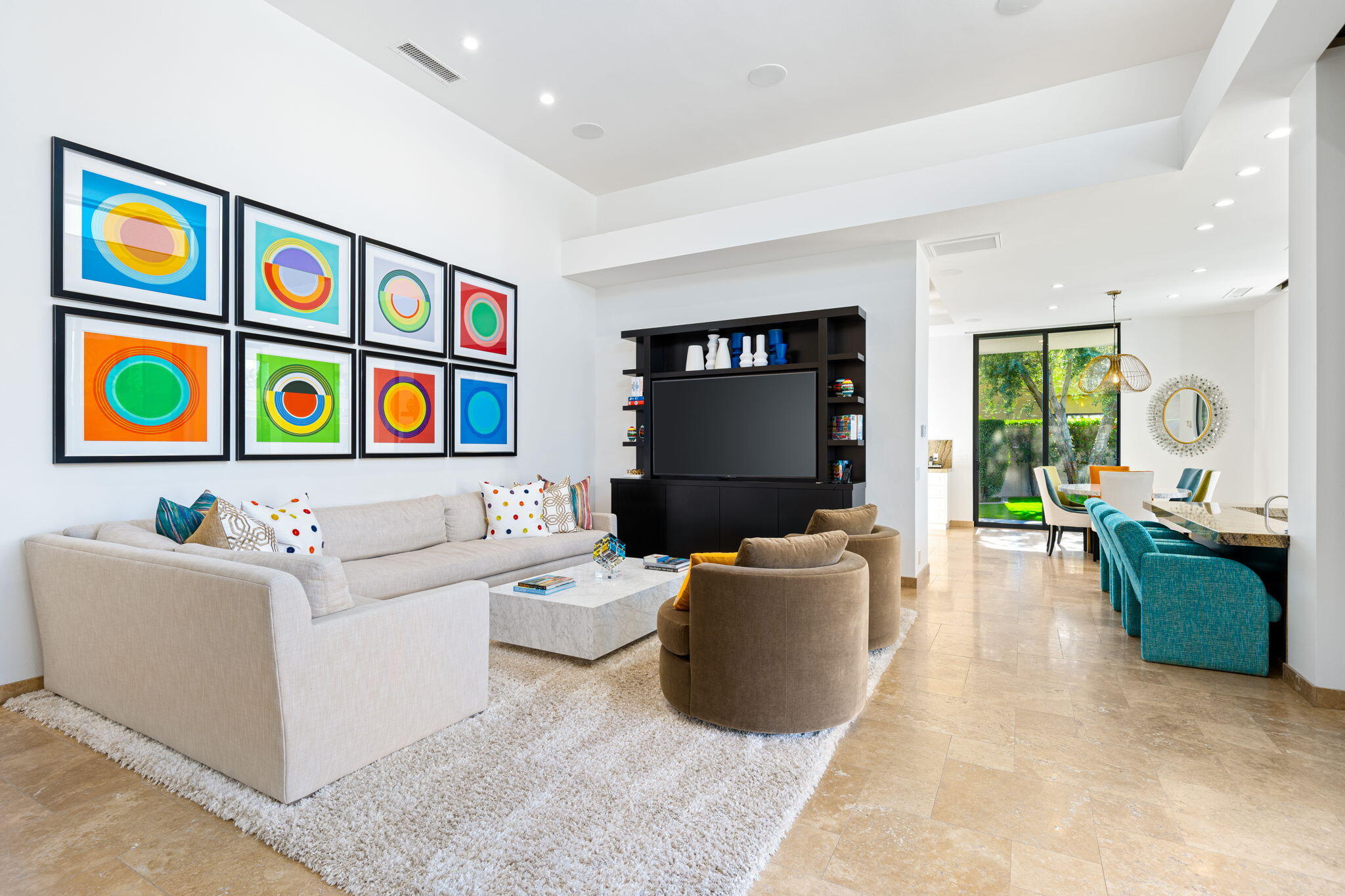 6 Sun Ridge Circle Rancho Mirage, CA 92270 - Photo 18 of 56 a living room with furniture and a flat screen tv