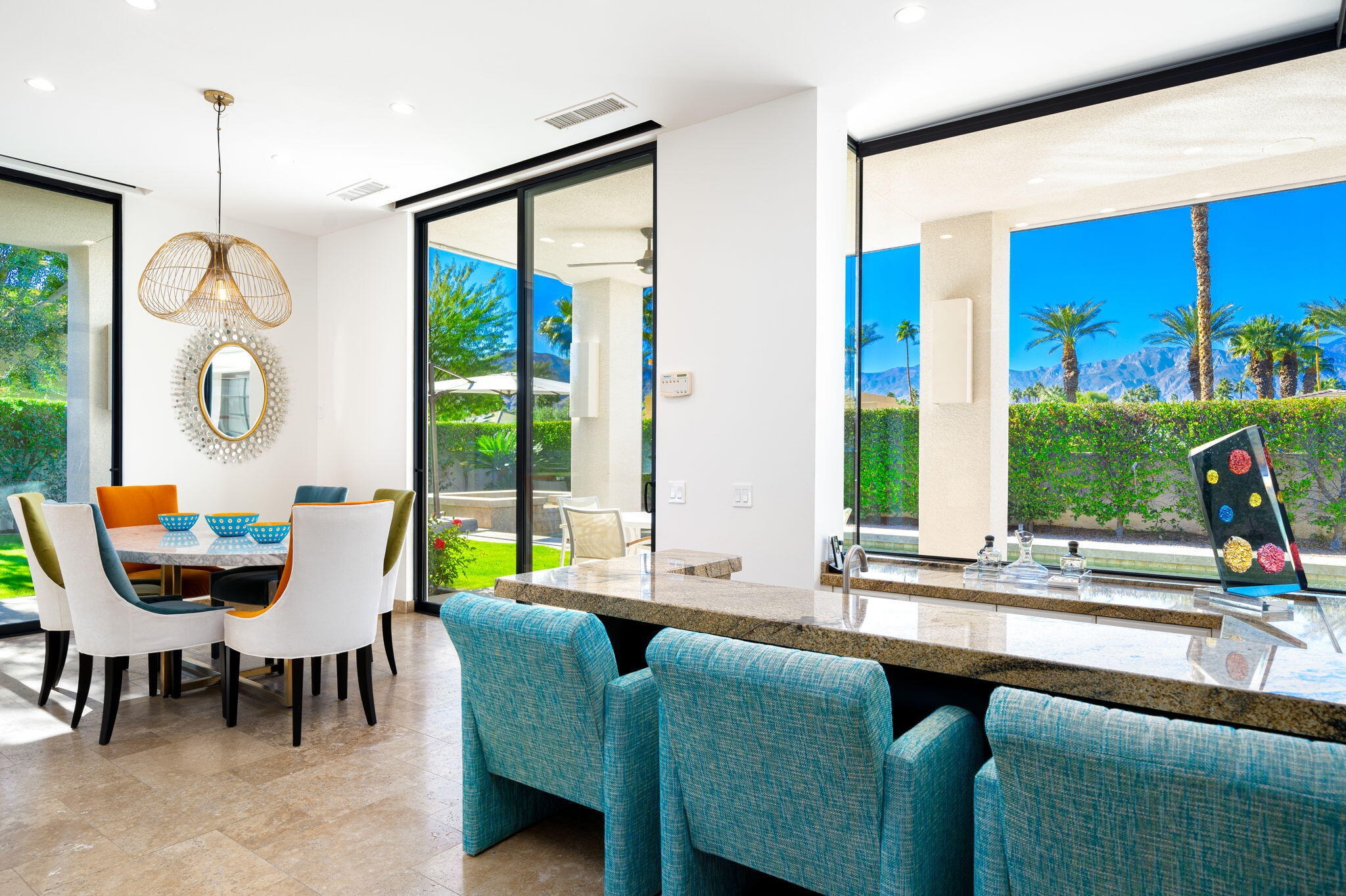 6 Sun Ridge Circle Rancho Mirage, CA 92270 - Photo 20 of 56 a view of a dining room with furniture and window