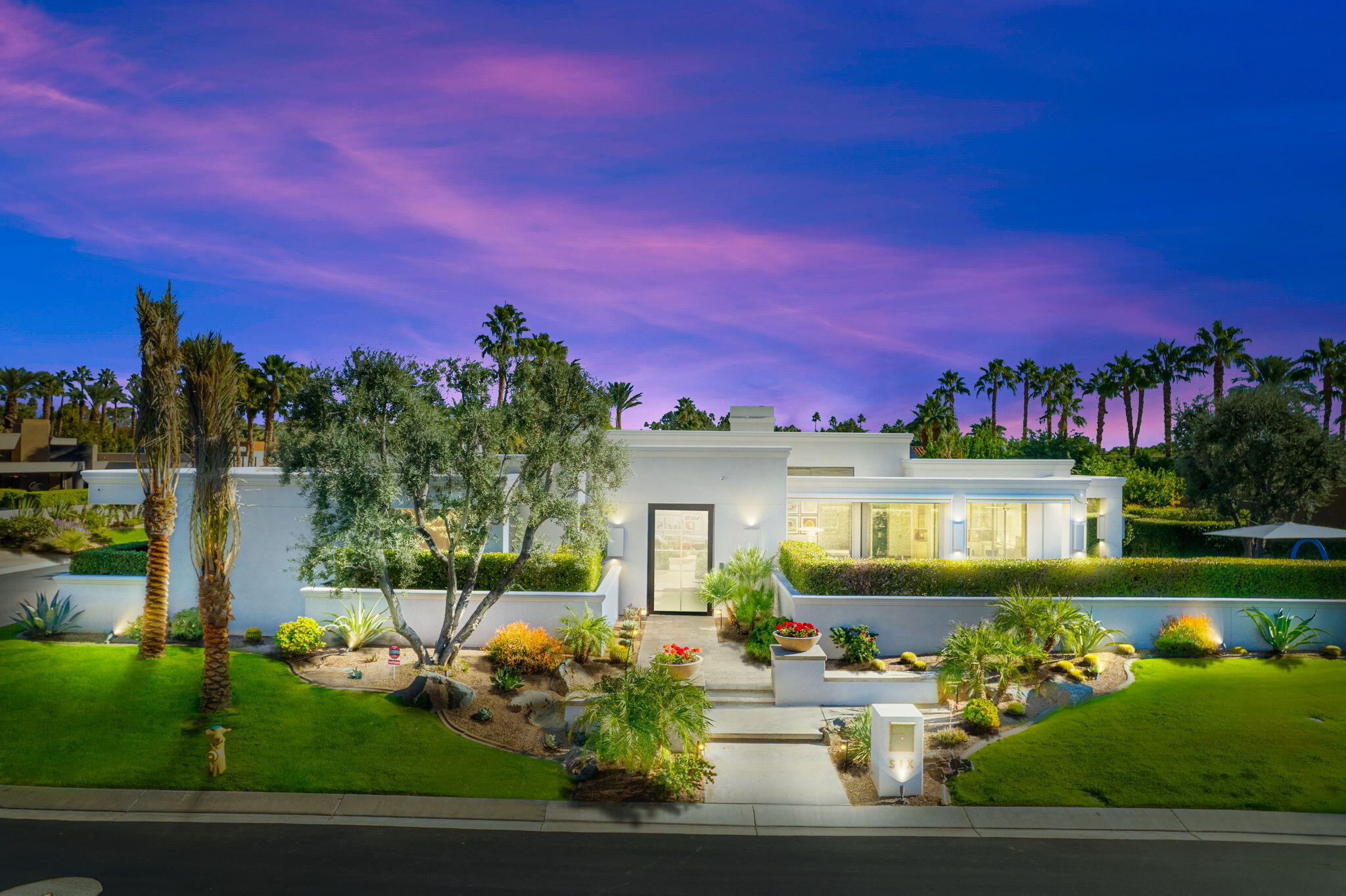 6 Sun Ridge Circle Rancho Mirage, CA 92270 - Photo 2 of 56 a front view of a house with a yard