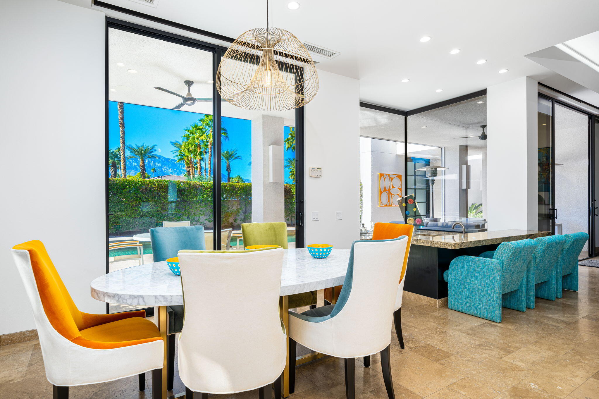 6 Sun Ridge Circle Rancho Mirage, CA 92270 - Photo 21 of 56 a view of a dining room with furniture a chandelier and wooden floor