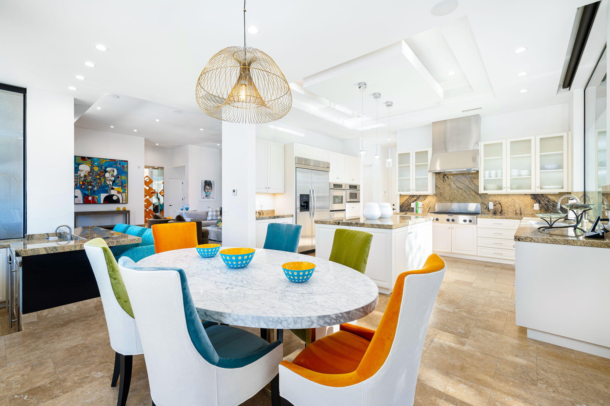 6 Sun Ridge Circle Rancho Mirage, CA 92270 - Photo 23 of 56 a dining room with stainless steel appliances kitchen island granite countertop a dining table chairs and a living room view