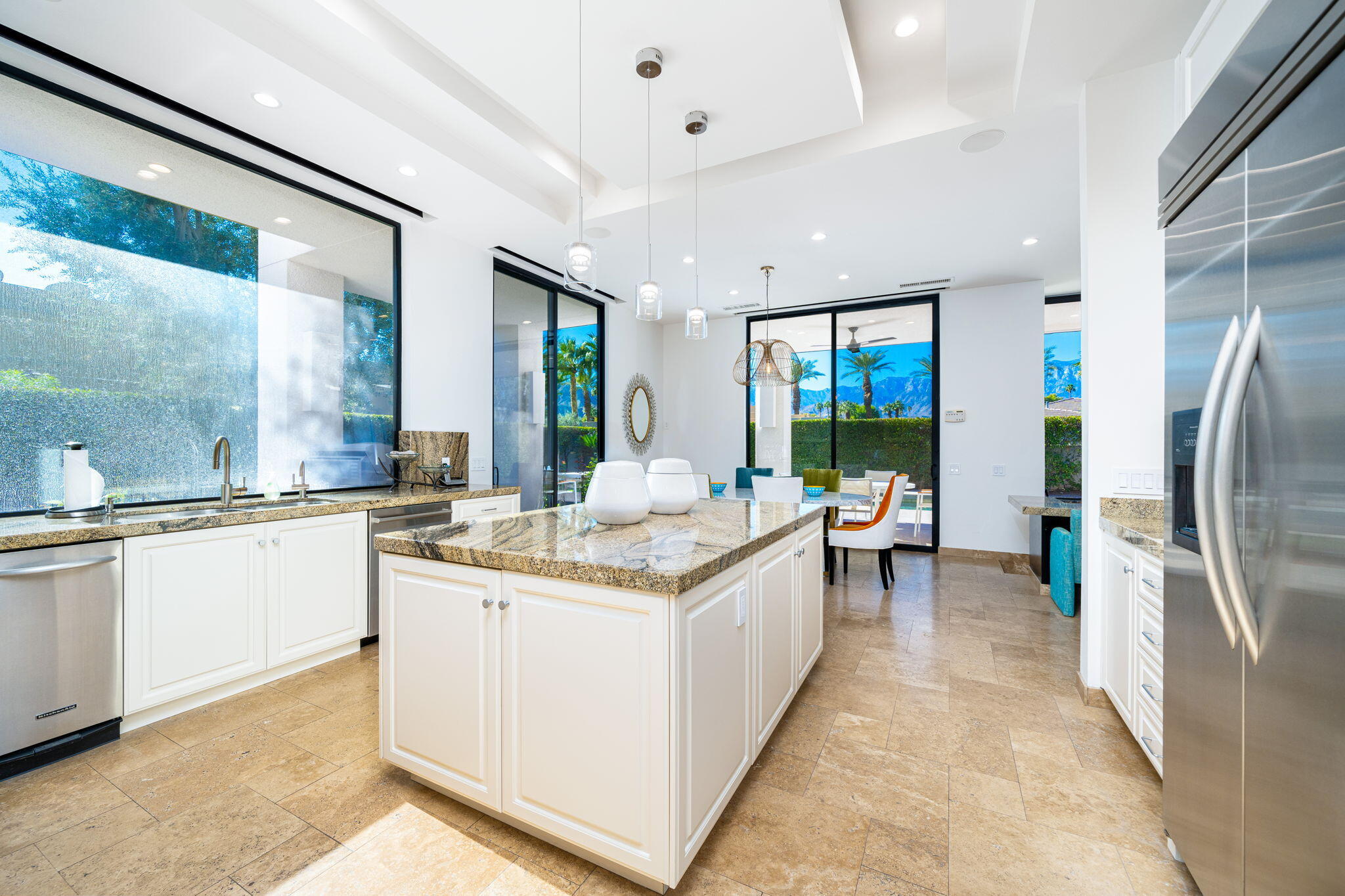 6 Sun Ridge Circle Rancho Mirage, CA 92270 - Photo 25 of 56 a large white kitchen with a large window