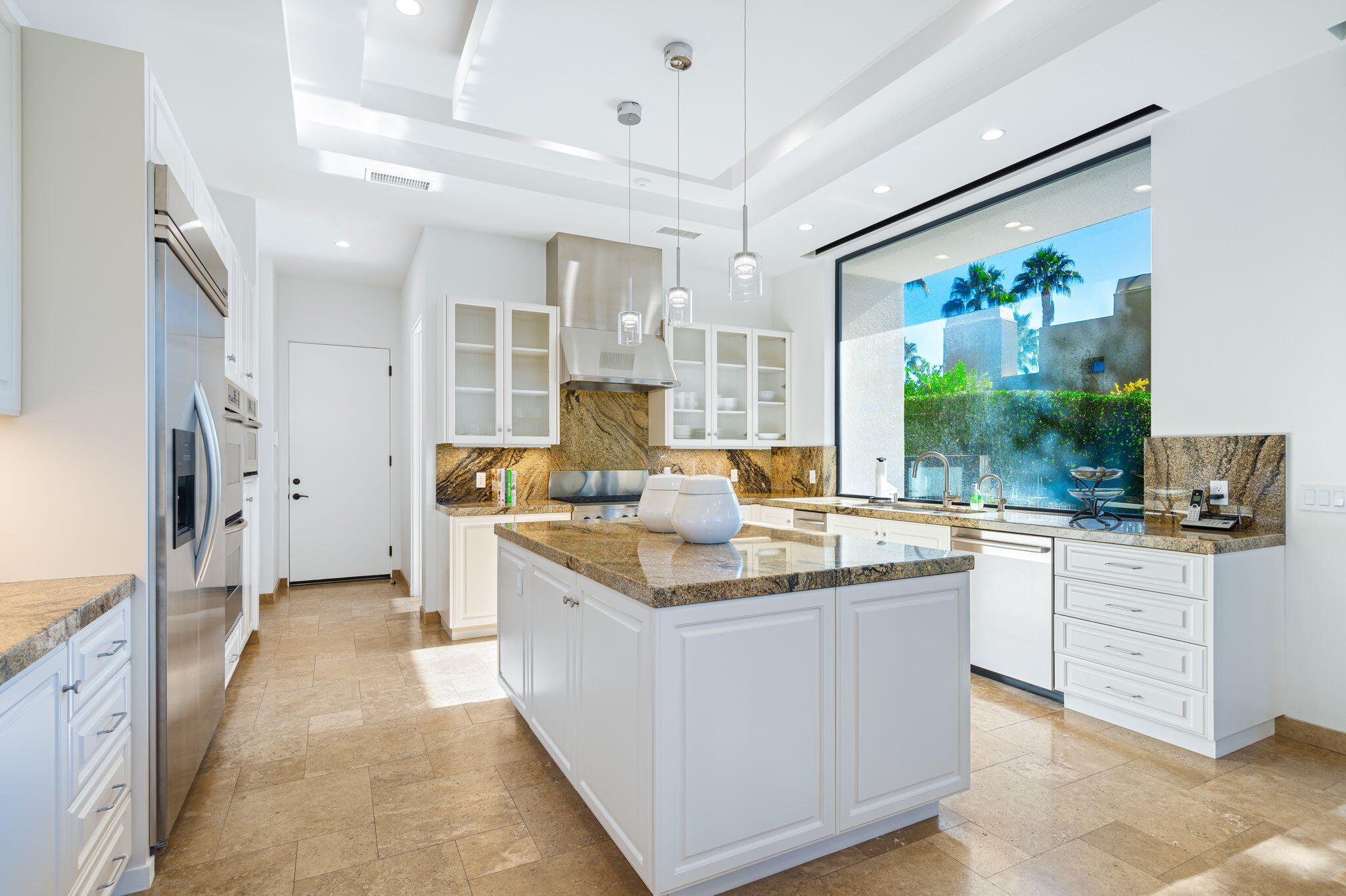 6 Sun Ridge Circle Rancho Mirage, CA 92270 - Photo 26 of 56 a kitchen with stainless steel appliances granite countertop a stove and a sink