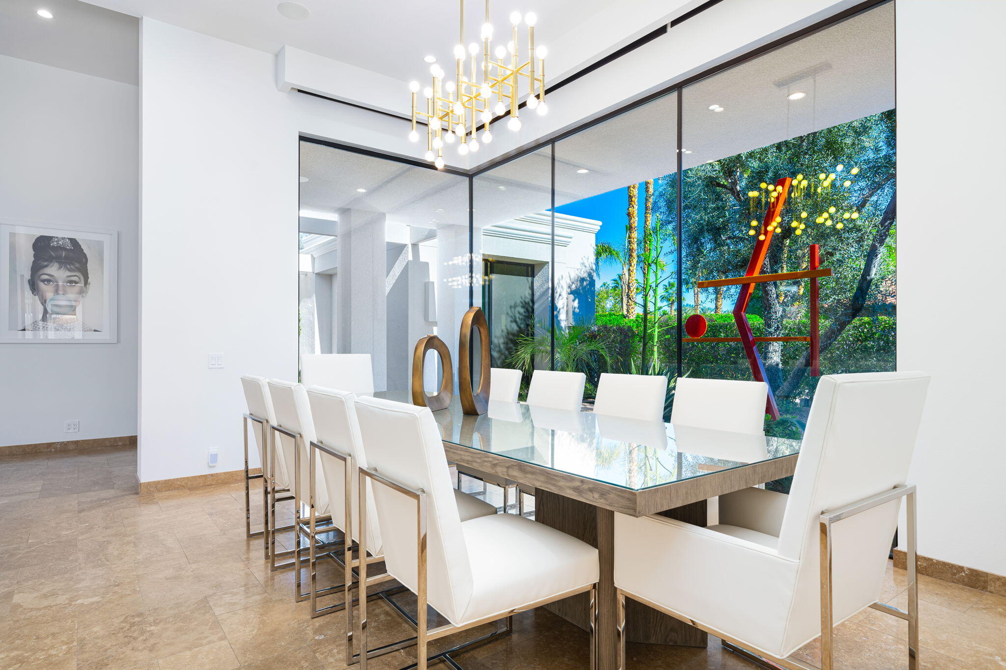 6 Sun Ridge Circle Rancho Mirage, CA 92270 - Photo 28 of 56 a view of a dining room with furniture a chandelier and large window