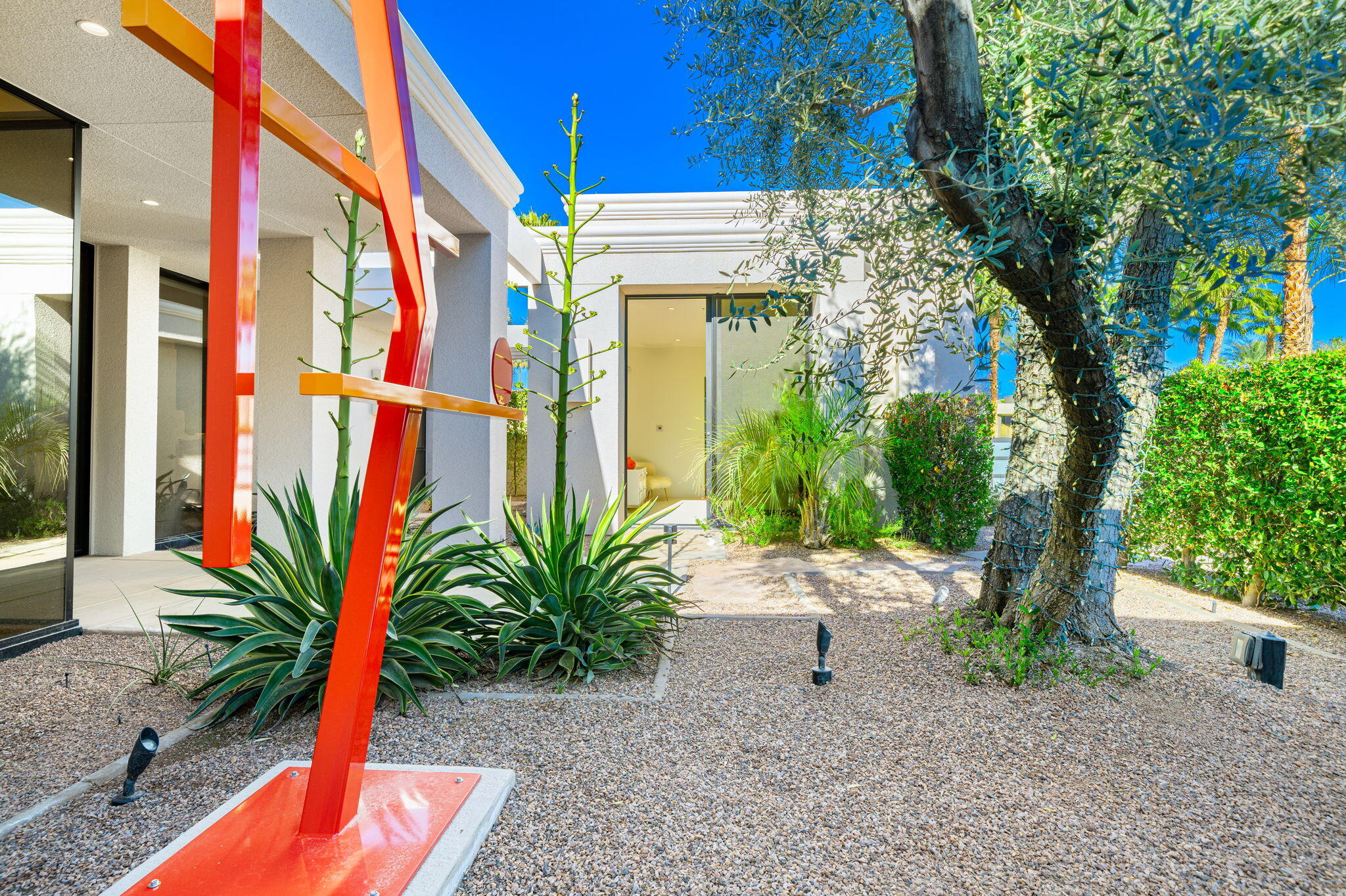 6 Sun Ridge Circle Rancho Mirage, CA 92270 - Photo 30 of 56 a potted plant sitting in front of a building