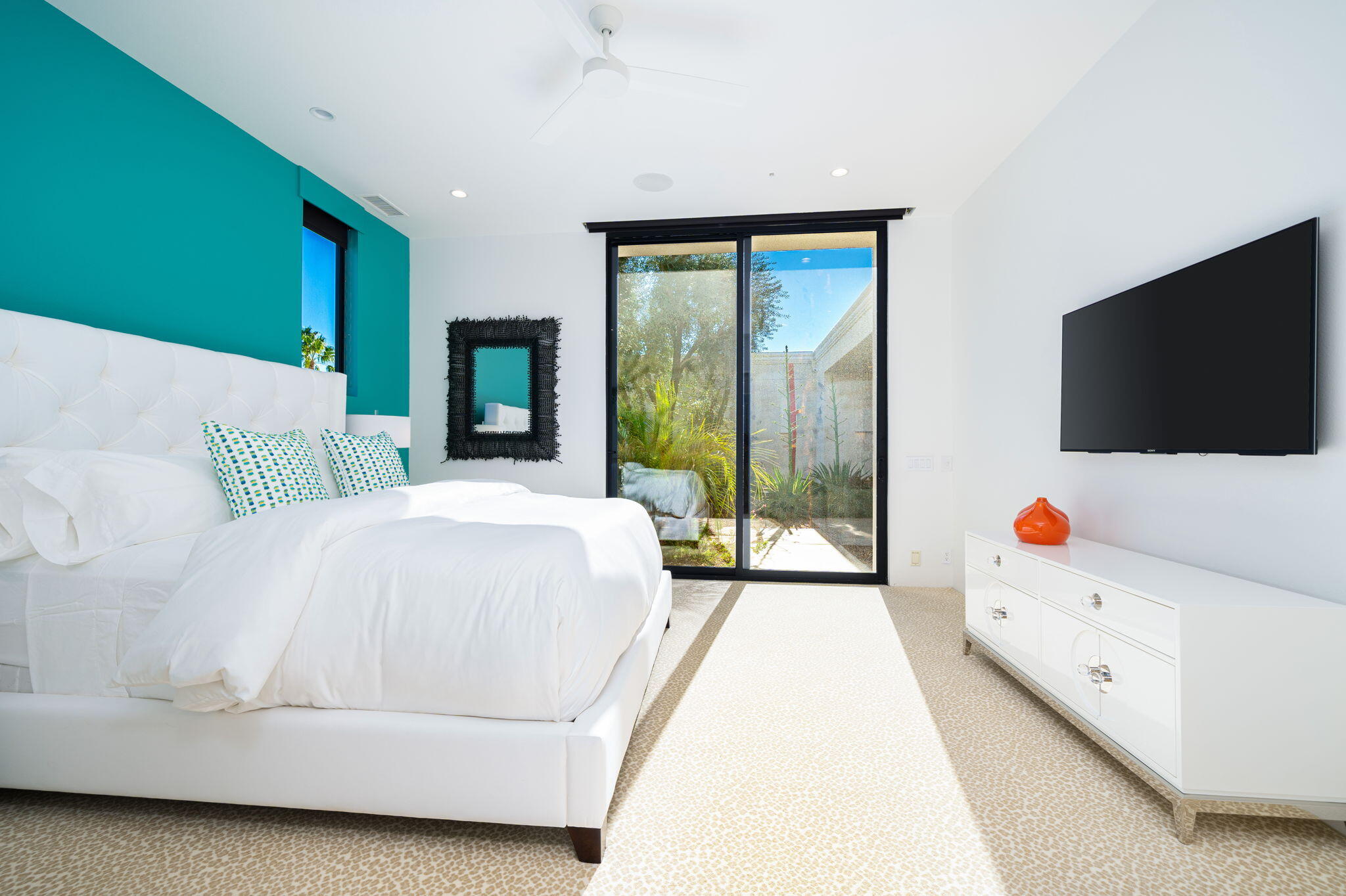 6 Sun Ridge Circle Rancho Mirage, CA 92270 - Photo 45 of 56 a bedroom with a bed and a flat tv screen next to a window