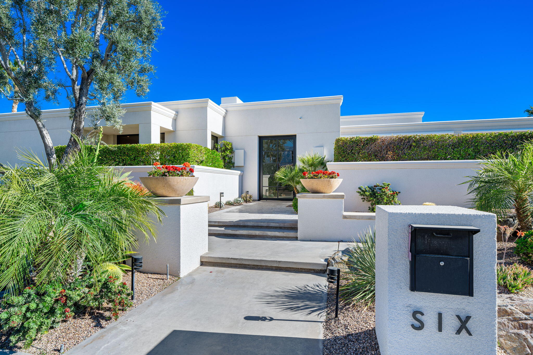 6 Sun Ridge Circle Rancho Mirage, CA 92270 - Photo 47 of 56 a view of house with outdoor space and sitting area