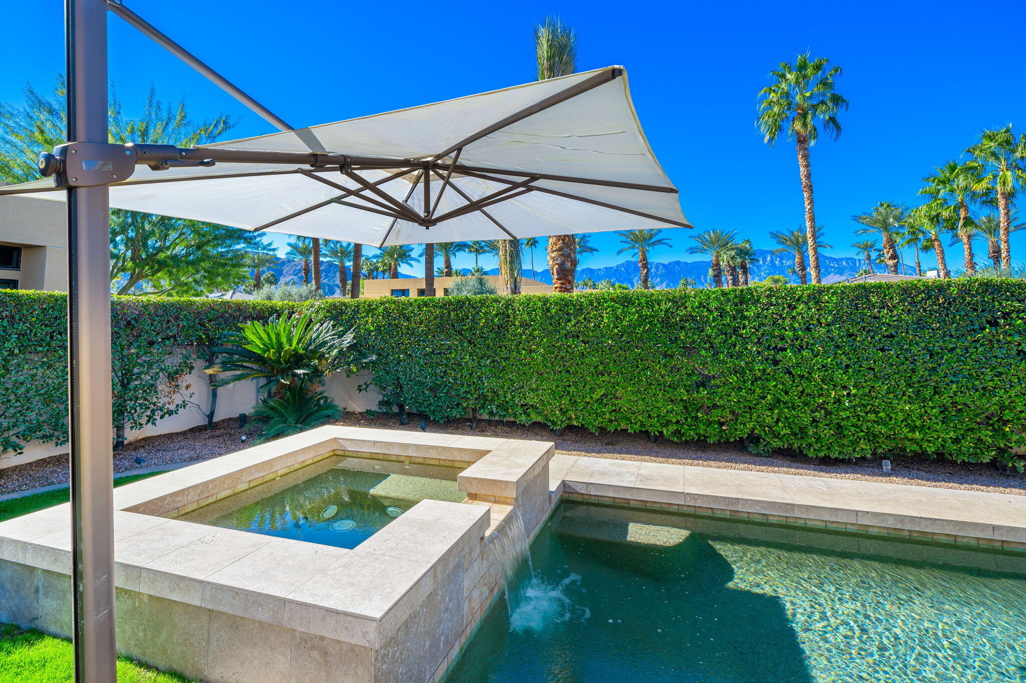 6 Sun Ridge Circle Rancho Mirage, CA 92270 - Photo 54 of 56 a view of swimming pool with lawn chairs plants and large tree