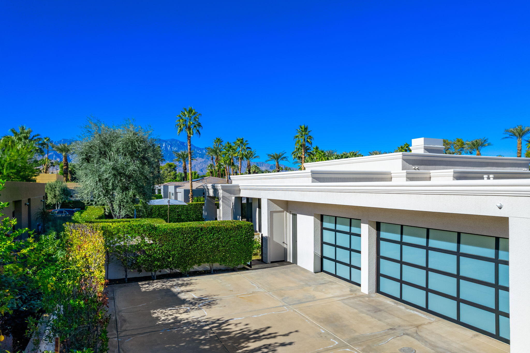 6 Sun Ridge Circle Rancho Mirage, CA 92270 - Photo 6 of 56 a view of a house with a yard and potted plants