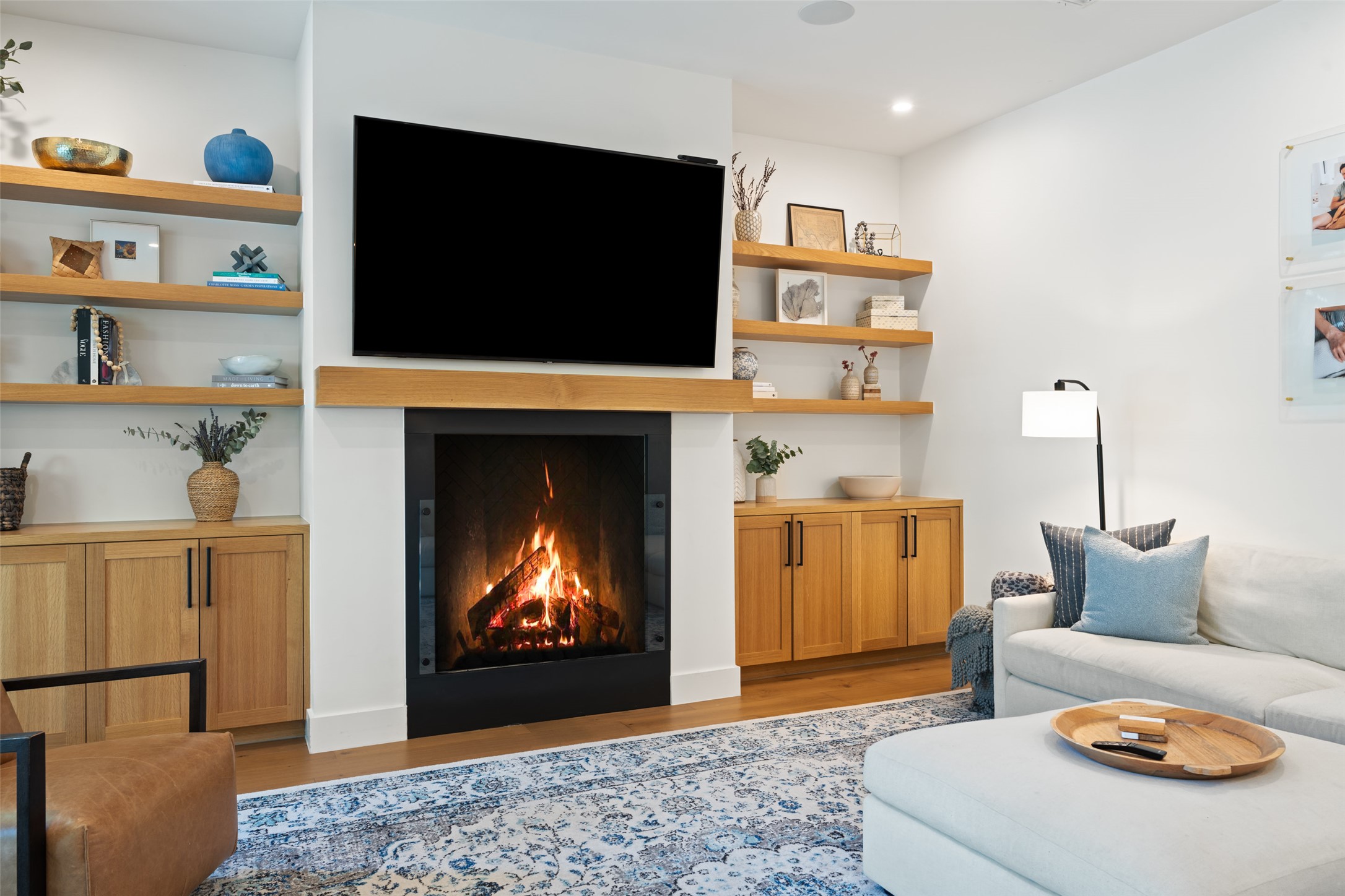 2107 Peach Tree Street Austin, TX 78704 - Photo 15 of 40 Living area featuring light wood-style floors, a warm lit fireplace, and recessed lighting