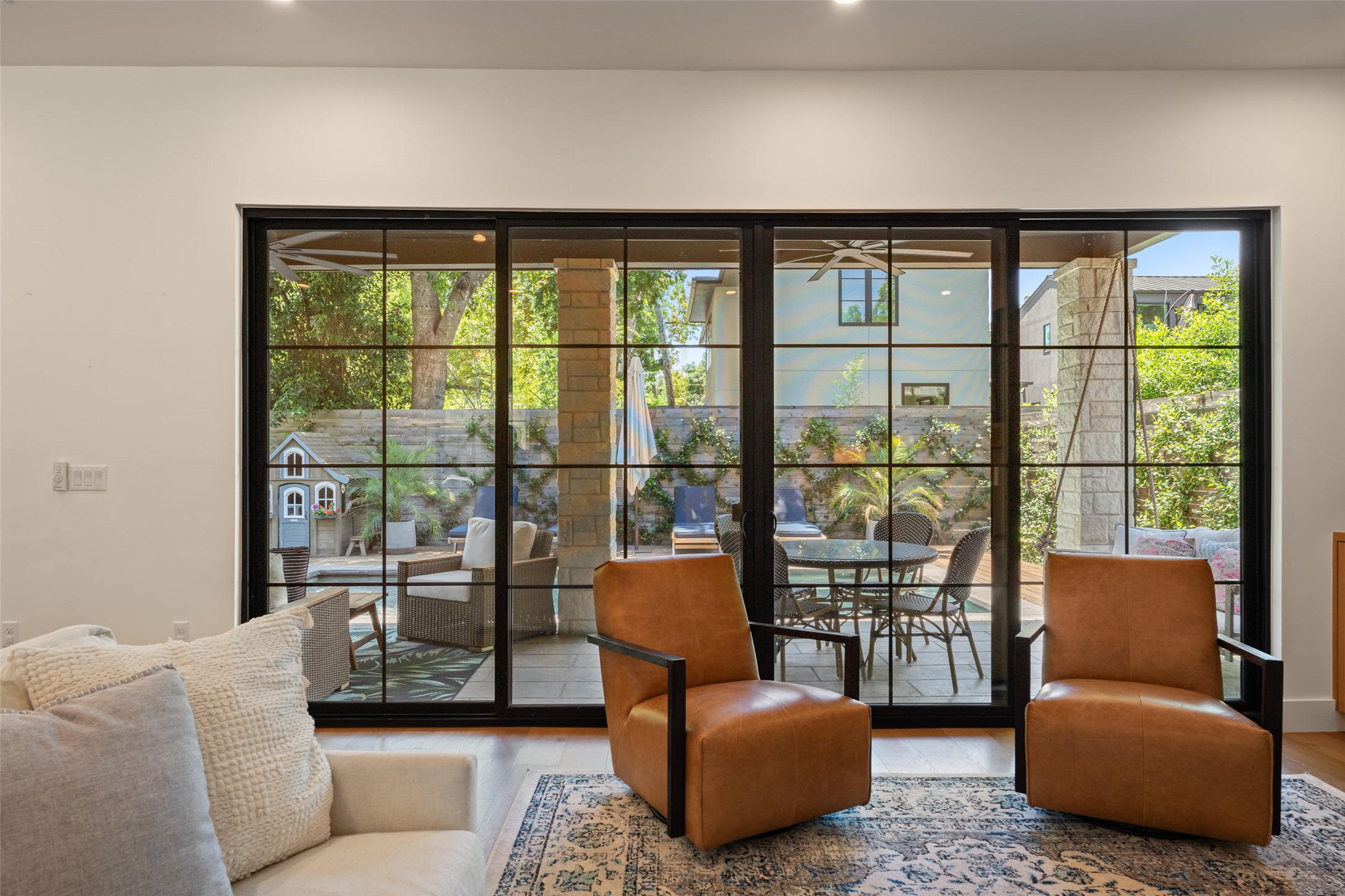 2107 Peach Tree Street Austin, TX 78704 - Photo 16 of 40 Doorway with wood finished floors, ceiling fan, and recessed lighting