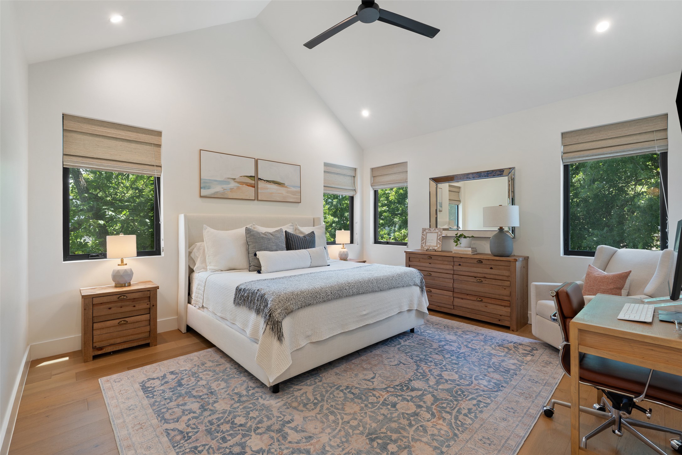 2107 Peach Tree Street Austin, TX 78704 - Photo 17 of 40 Bedroom with high vaulted ceiling, multiple windows, an office area, recessed lighting, and light wood finished floors