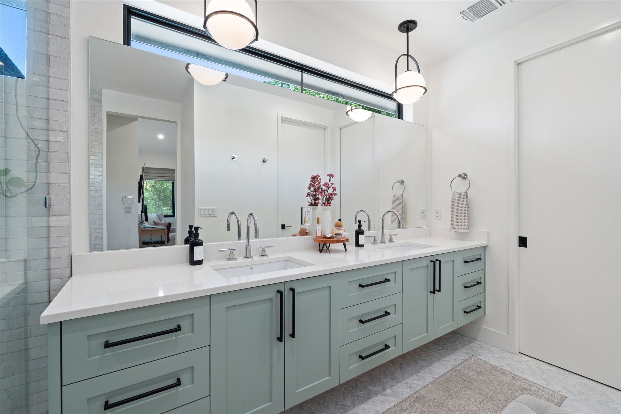 2107 Peach Tree Street Austin, TX 78704 - Photo 19 of 40 Bathroom featuring double vanity, tiled shower, and connected bathroom