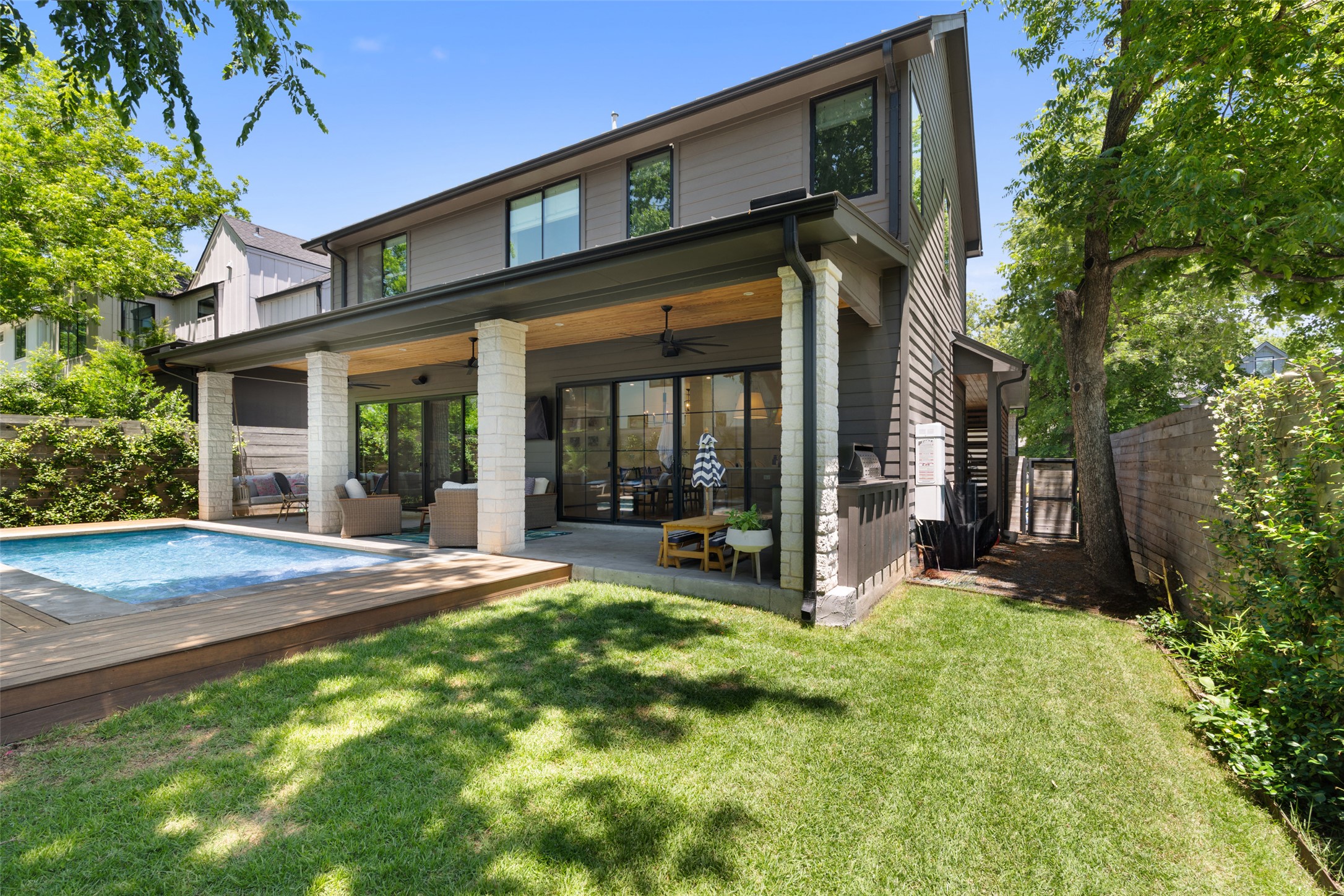 2107 Peach Tree Street Austin, TX 78704 - Photo 32 of 40 Back of property with ceiling fan and an outdoor hangout area