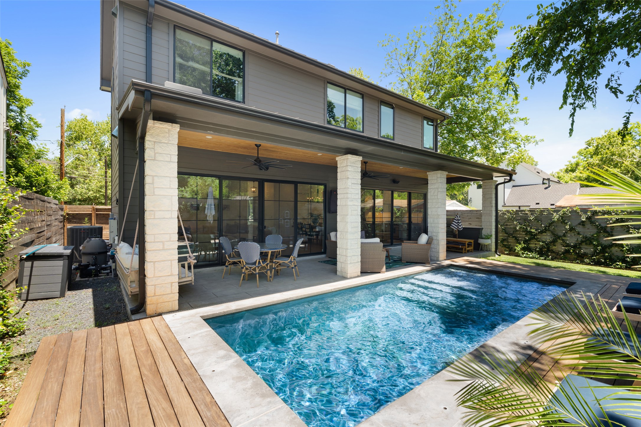 2107 Peach Tree Street Austin, TX 78704 - Photo 34 of 40 Rear view of property featuring ceiling fan, a patio, a fenced backyard, and outdoor dining area