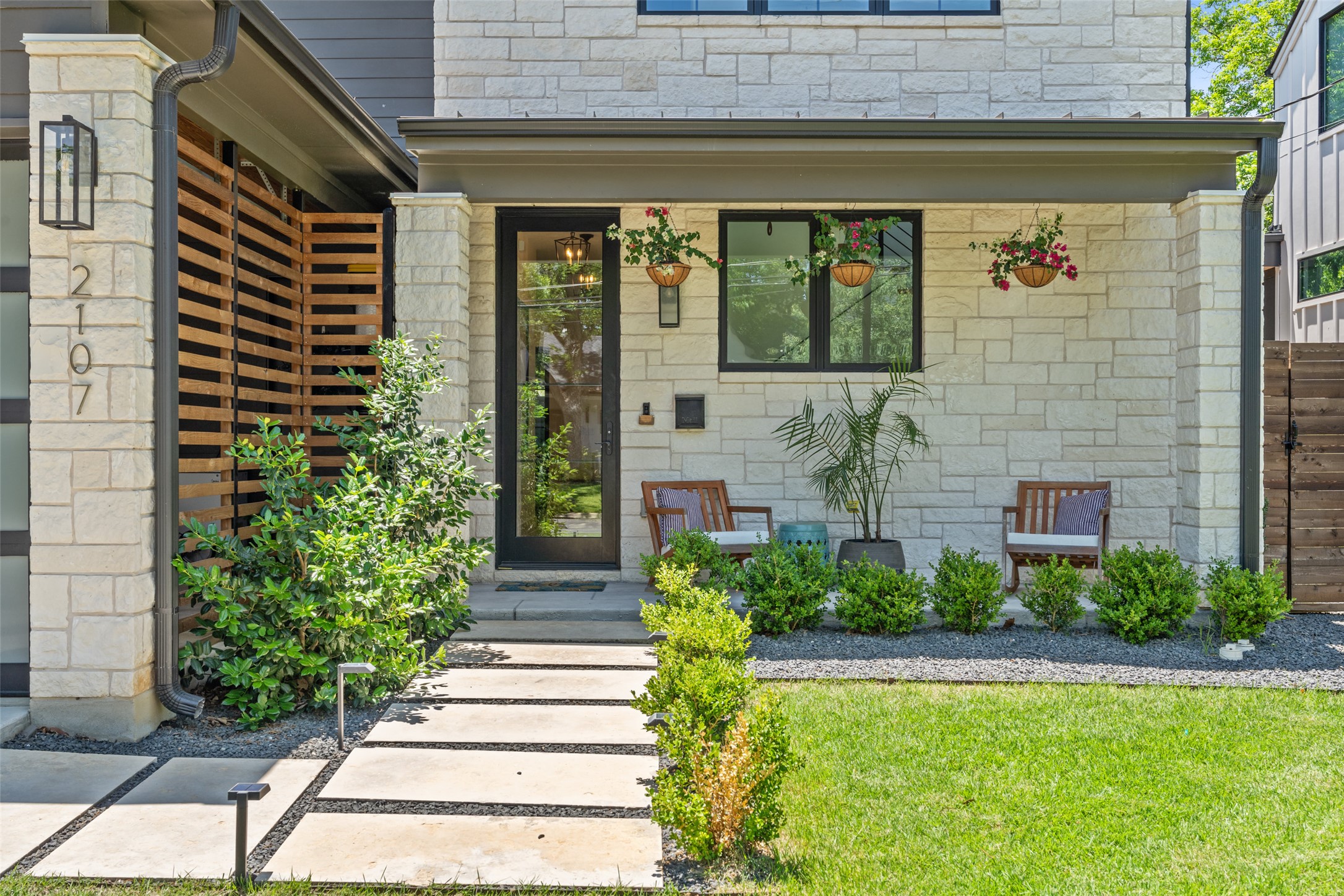 2107 Peach Tree Street Austin, TX 78704 - Photo 6 of 40 Doorway to property featuring stone siding