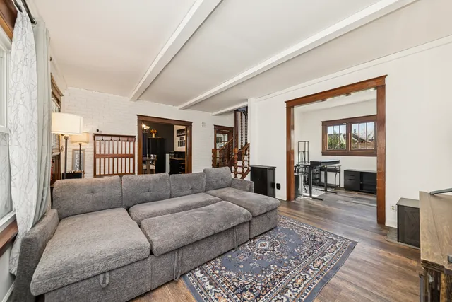 a living room with furniture and a rug
