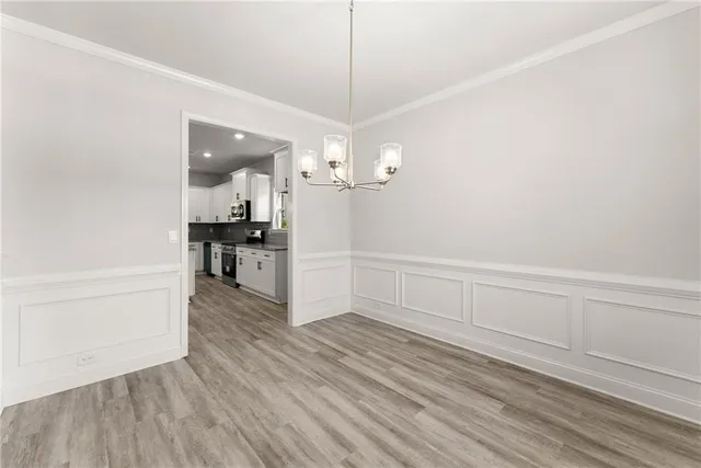 a view of a kitchen cabinets and wooden floor
