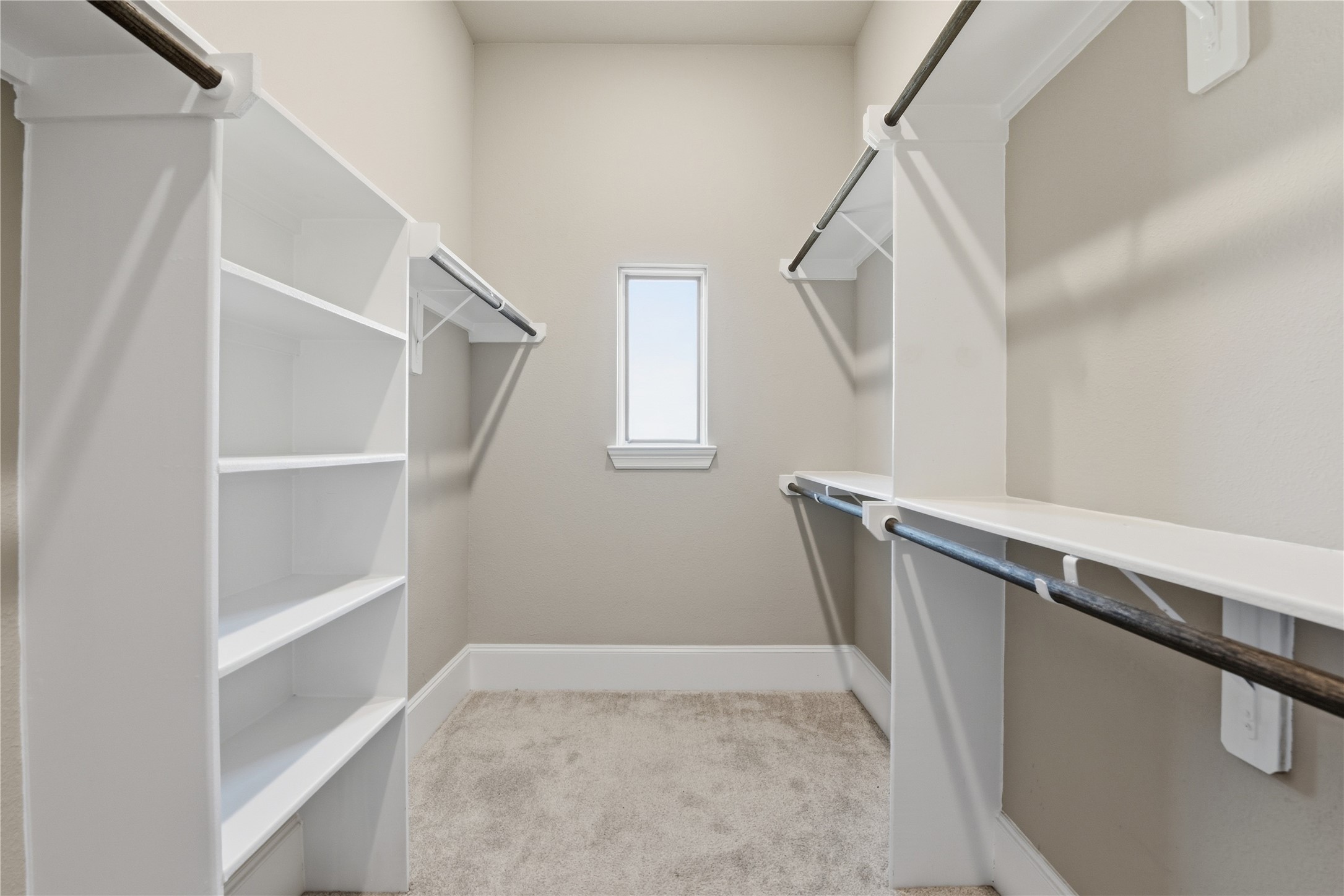 17501 Spice Merlot Lane Conroe, TX 77302 - Photo 30 of 50 a view of walk in closet with empty racks