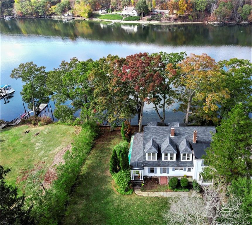 an aerial view of a house with a lake view