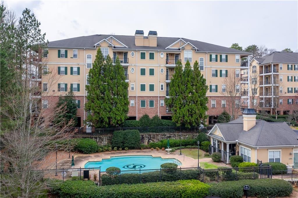 3208 Stratford Commons Decatur, GA 30033 - Photo 1 of 1 a front view of a residential apartment building with a yard