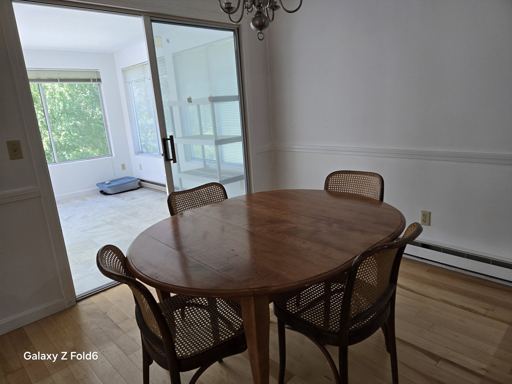 222 Buck Island Road, Unit 45 Yarmouth, MA 02673 - Photo 8 of 23 a view of a dining room with furniture and window