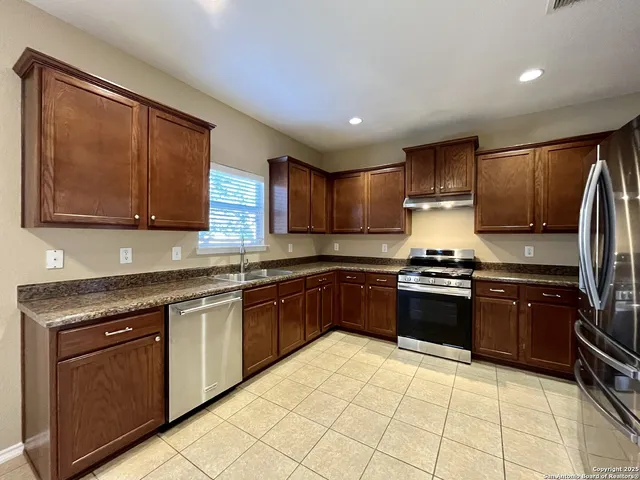 a kitchen with a stove and a microwave