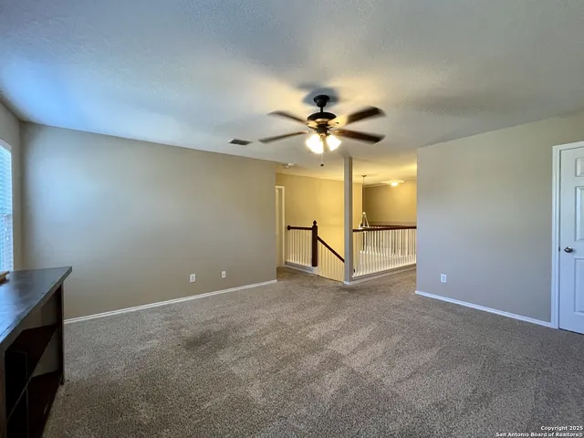 a view of a hallway view with staircase