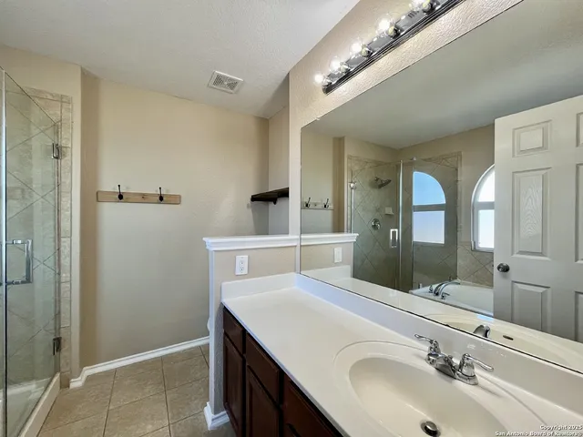 a bathroom with a tub and a shower