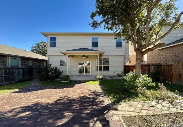 a view of a swimming pool with a yard