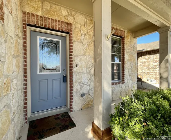 a living room with furniture and a grill