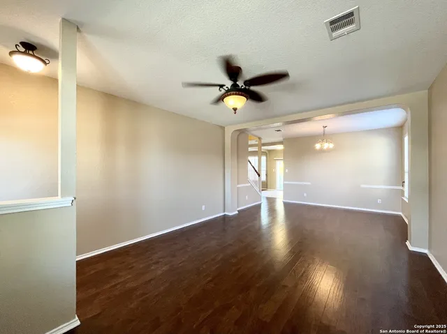 a large kitchen with a large counter top stainless steel appliances and cabinets