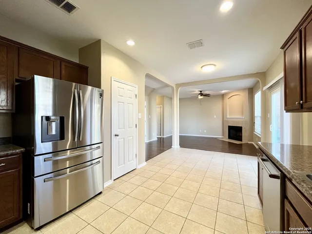 wooden floor in an empty room with a fireplace