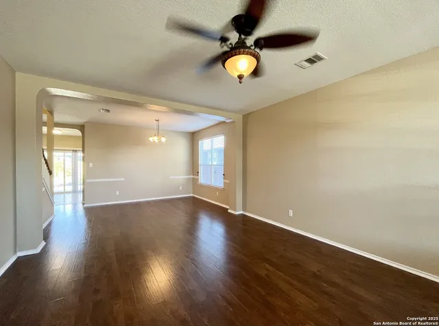 an empty room with wooden floor