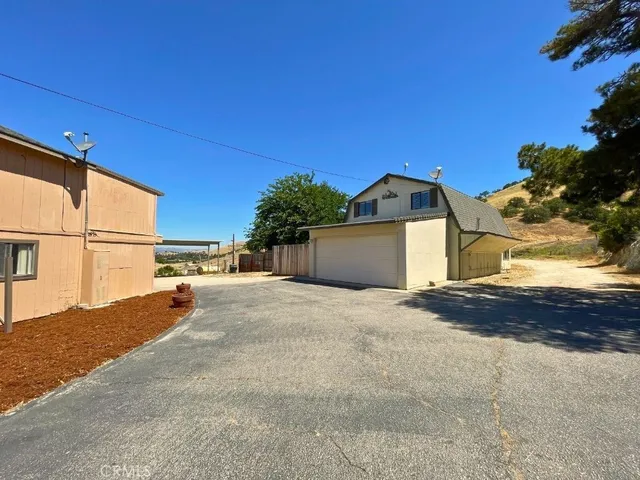 a view of a street with a building in the background