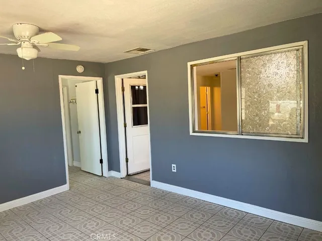 a bathroom with a double vanity sink a toilet and a mirror