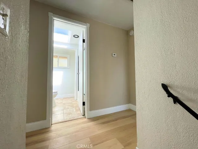 a bathroom with a glass shower door