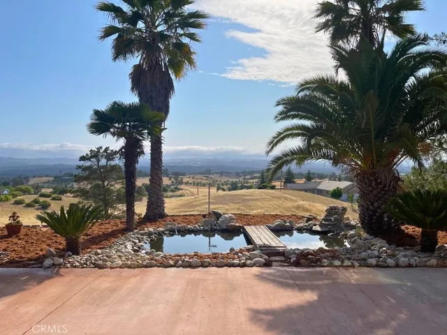 a view of a backyard of a house with a patio