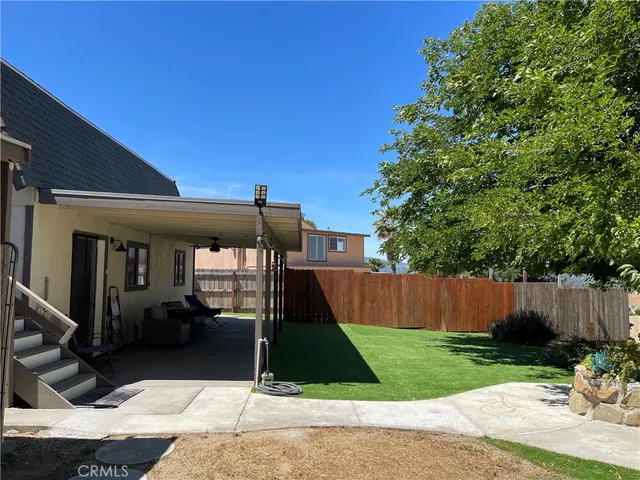 a kitchen with kitchen island a counter space a sink appliances and cabinets