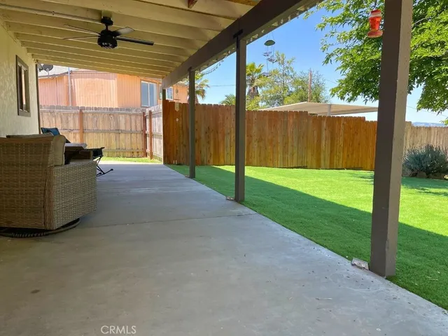 a large kitchen with a center island and stainless steel appliances