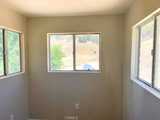 a view of a street with a yard