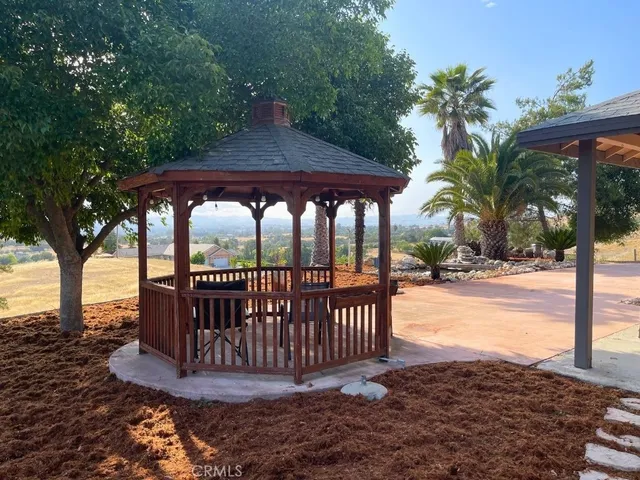 a view of a chair and table in the patio