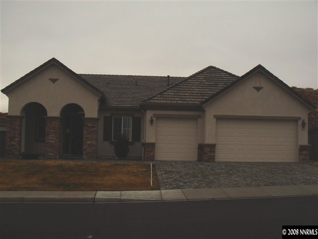 1045 South University Park Loop Reno, NV 89512 - Photo 1 of 9 a front view of a house