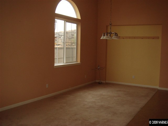 1045 South University Park Loop Reno, NV 89512 - Photo 2 of 9 an empty room with windows