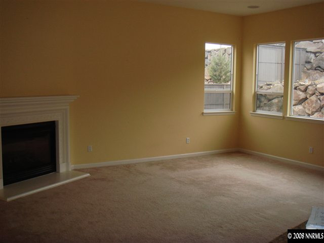 1045 South University Park Loop Reno, NV 89512 - Photo 5 of 9 a view of an empty room with windows