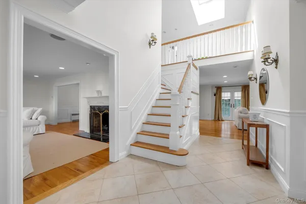 a view of a kitchen with furniture and staircase