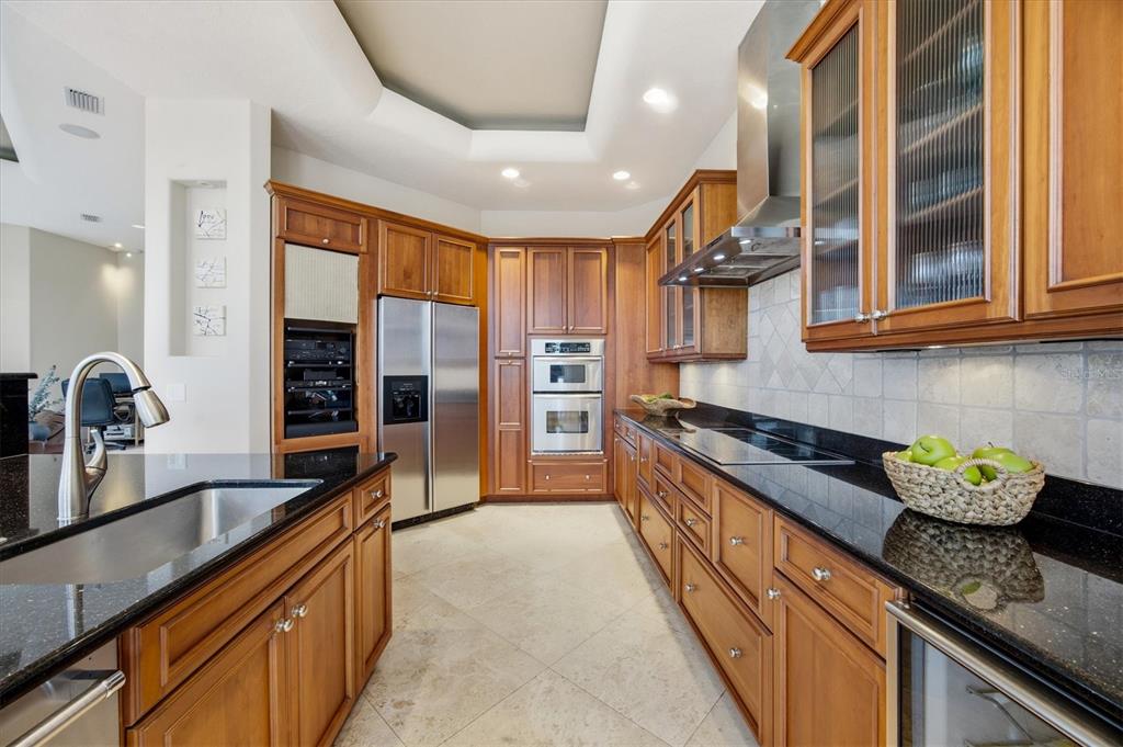761 Norton Street Longboat Key, FL 34228 - Photo 20 of 66 a kitchen with stainless steel appliances granite countertop a sink and stove